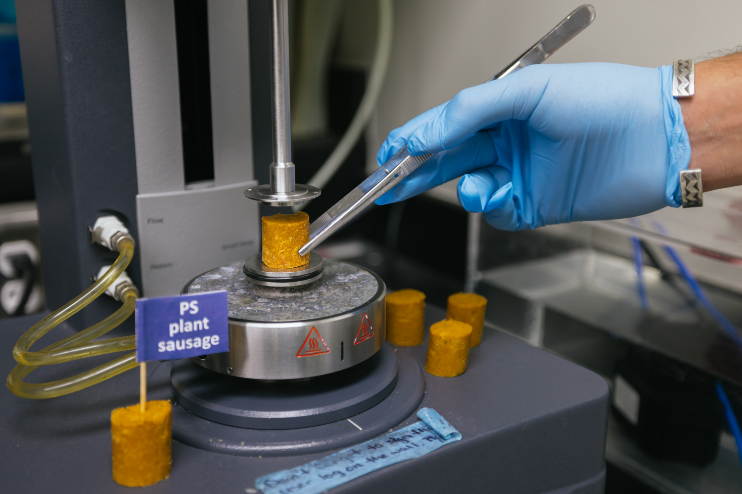 Plant-based meat undergoes a mechanical test to help quantify food texture.